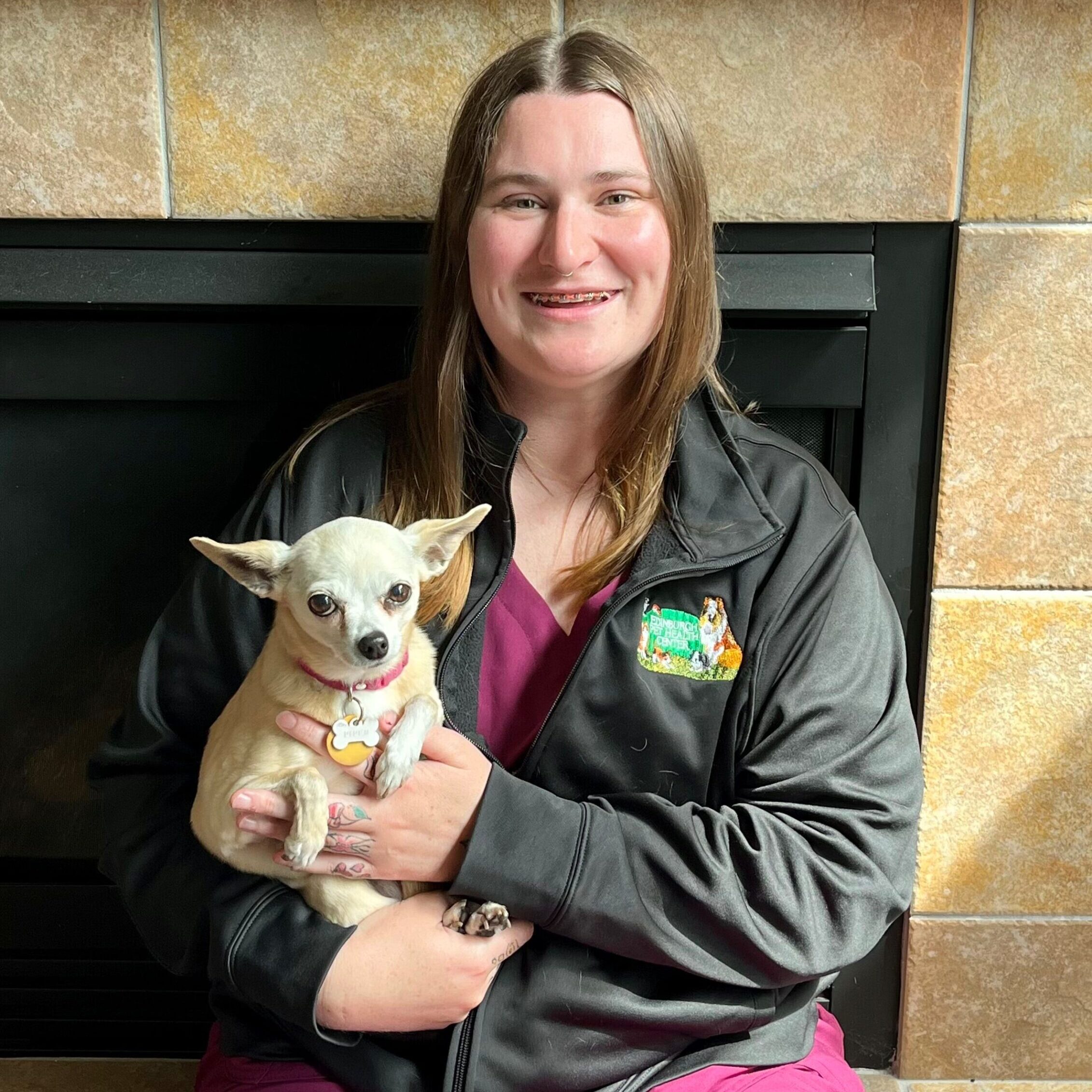 AleciaStaffPhoto Woman Smiling Holding a small dog