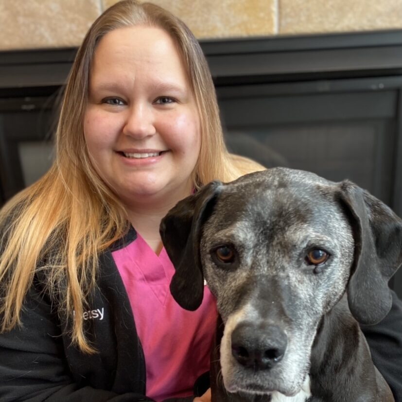 woman smiling with her large dog