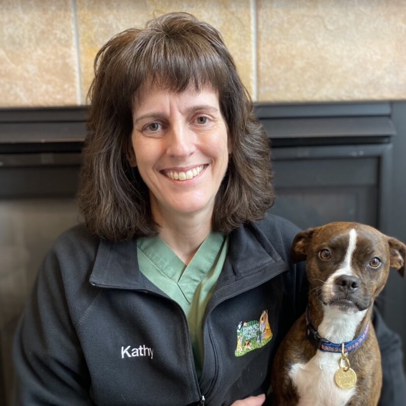 woman smiling with her small dog